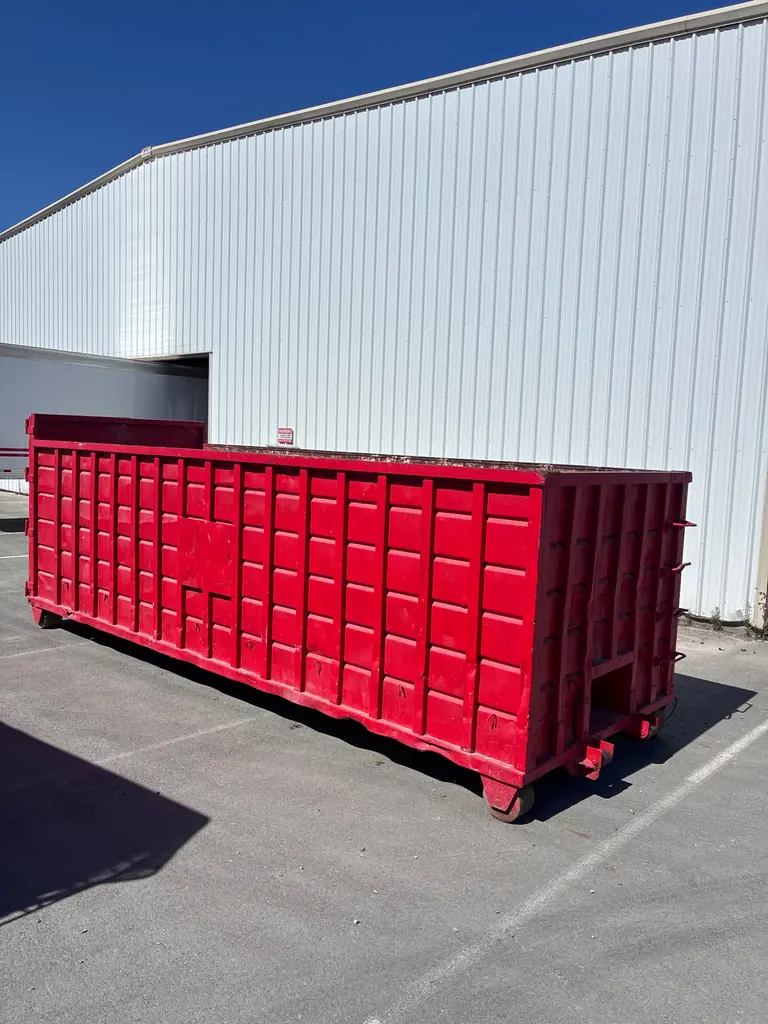 Roll-off dumpster staged for an emergency cleanup job in San Diego County